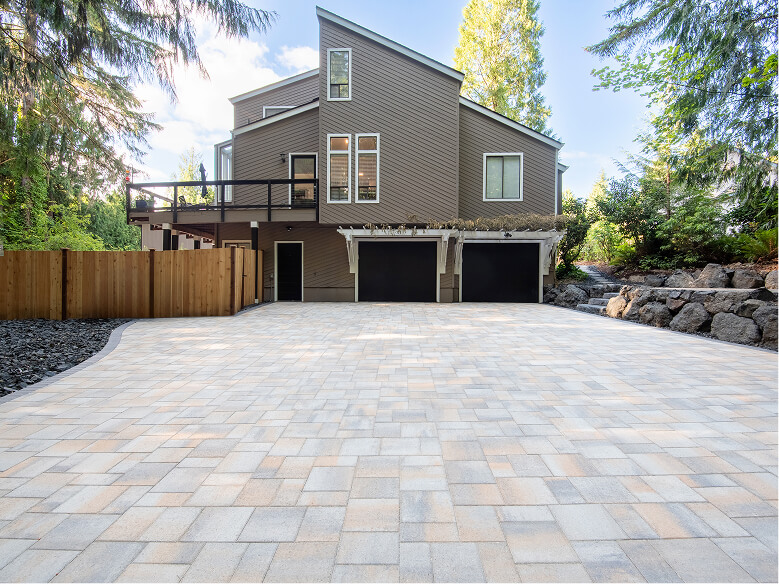 Beautiful backyard with Paver Patio Installation Olympia WA and modern outdoor furniture.