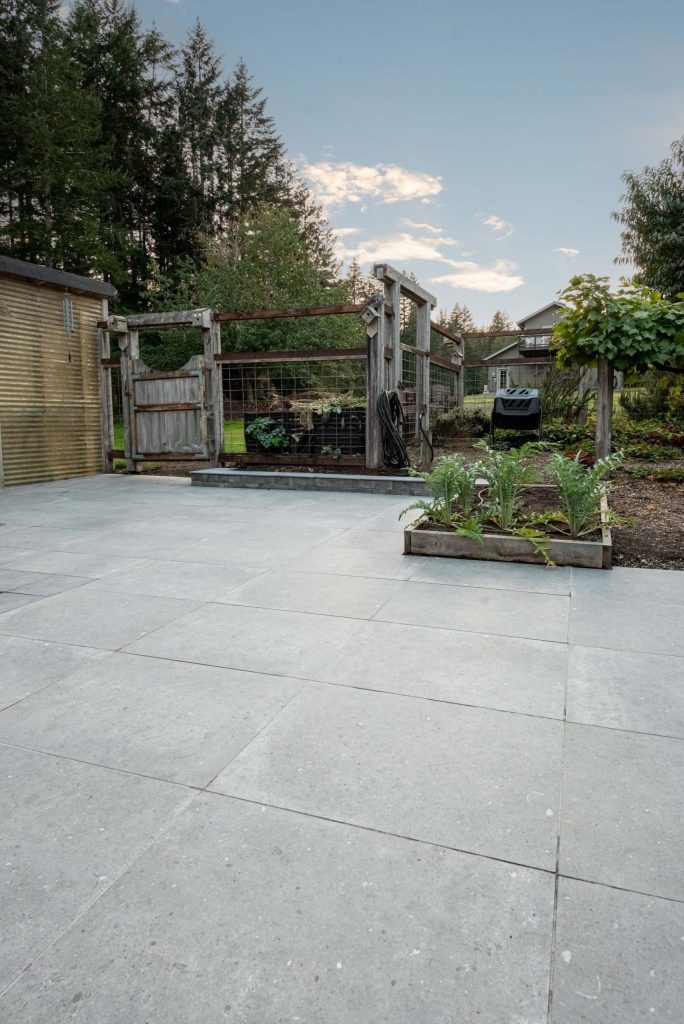 High quality porcelain tile installation on a wide outdoor entertainment area scaled